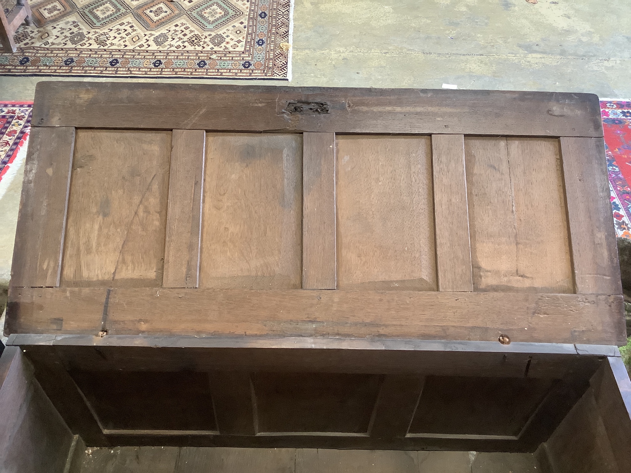 A 17th century panelled oak coffer, W.122cm D.55cm H.65cm